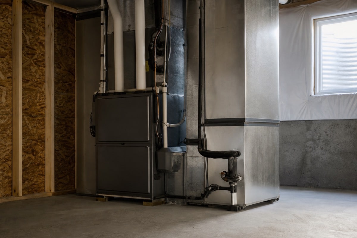 Gas furnace and HVAC air handler in a basement mechanical room